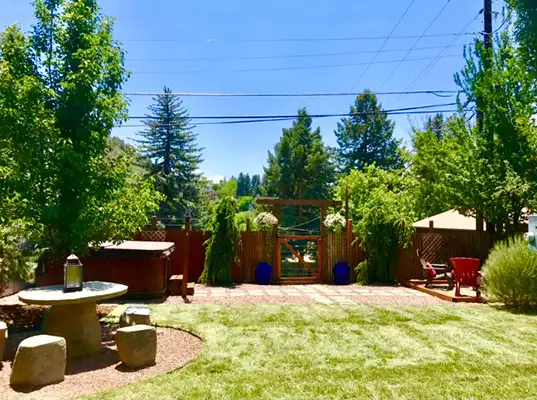 Landscaped lawn in Durango with fence and gate