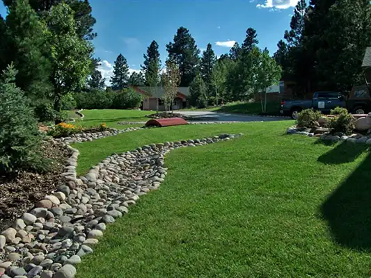 Water mitigation in a large lawn using a cobble river
